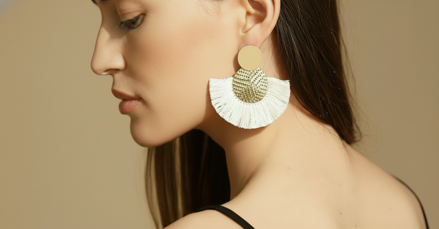 Ivory Fringe Medallion earrings worn by a model